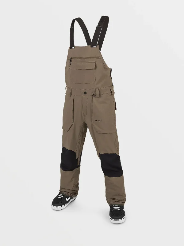 Multi-pocket pants for organized travel convenience -Volcom Roan Bib Overall 2024